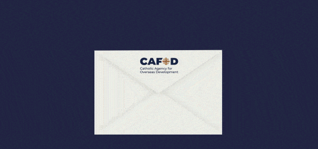 A gif showing a Christmas card coming out of an envelope