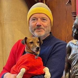 Fr. Robert Thompson and his dog, Cora