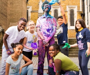 School children with coloured paint