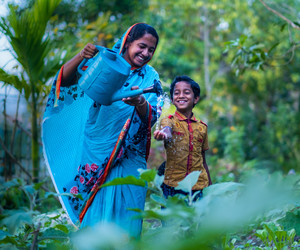 Shukla and her son in their vegetable garden
