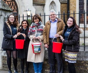 CAFOD staff with fundraising buckets
